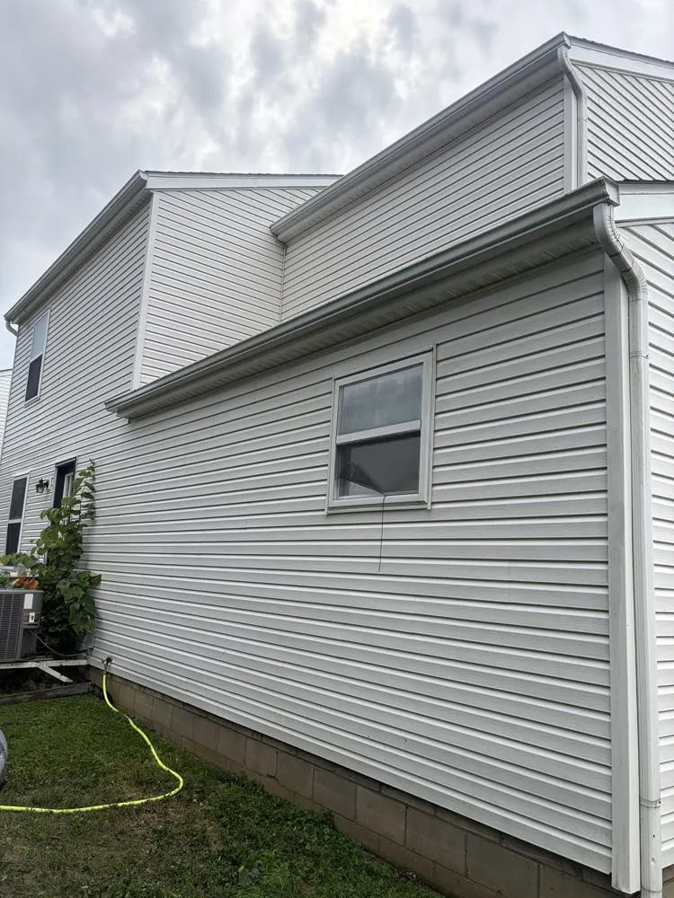 After: two-story siding clean after soft wash